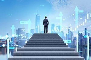 A businessman standing at the top of a flight of stairs looking out over the New York skyline