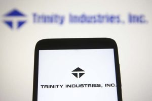The Trinity Industries logo on a smartphone