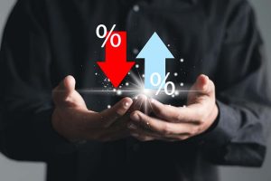 A person with their hands extended, holding up and down arrows and percentage signs