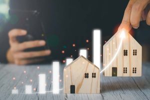 A graphic of a rising arrow next to two houses