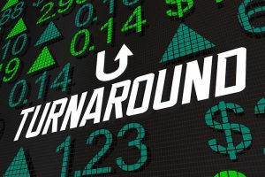 The word “TURNAROUND” in all capital letters surrounded by various stock prices