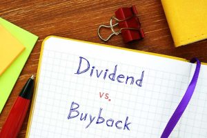 “Dividend vs. buyback” written on a notepad