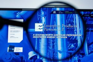 The Enterprise Products Partners logo on the company’s website under a magnifying glass
