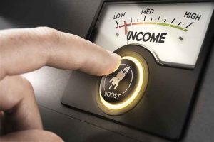 A finger pressing a “boost” button to push an income meter from “LOW” to “HIGH”