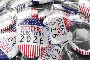 A pile of red, white, and blue buttons that say “Midterm Elections 2026”