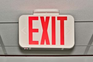 A red “EXIT” sign hanging from the ceiling