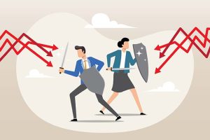 A graphic of a businessman and a businesswoman holding shields to fend off red, downward-facing arrows