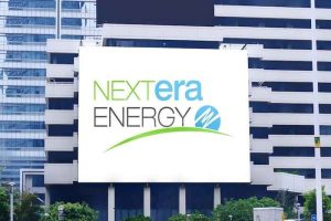 A sign displaying the NextEra Energy logo on one of the company’s buildings