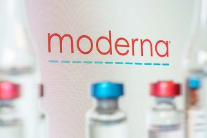 The Moderna logo with several glass containers in the foreground