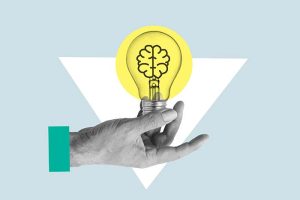 A cartoon of a hand holding a lightbulb with a brain inside of it